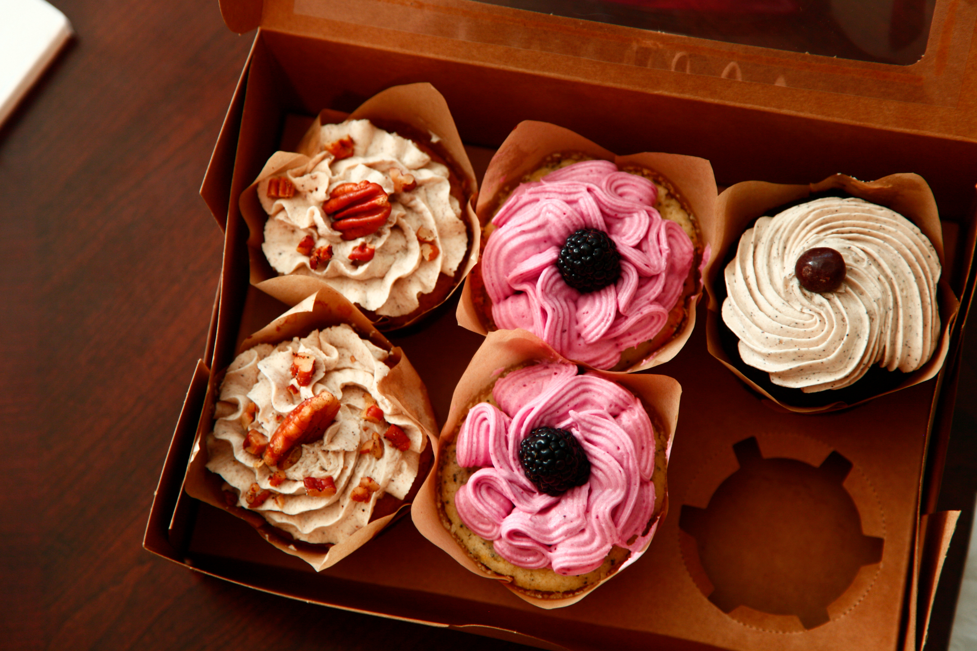 Hand piped pink cupcakes with cherry blossoms